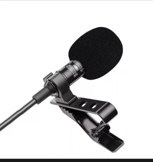 Lavalier microphone with clip on a white background