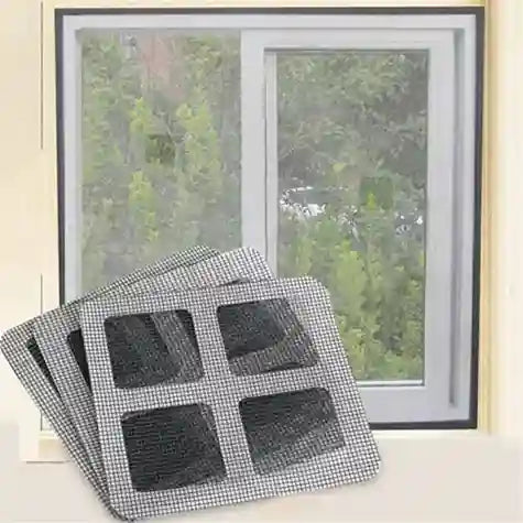 Window with a view of greenery and a stack of window screens in front.