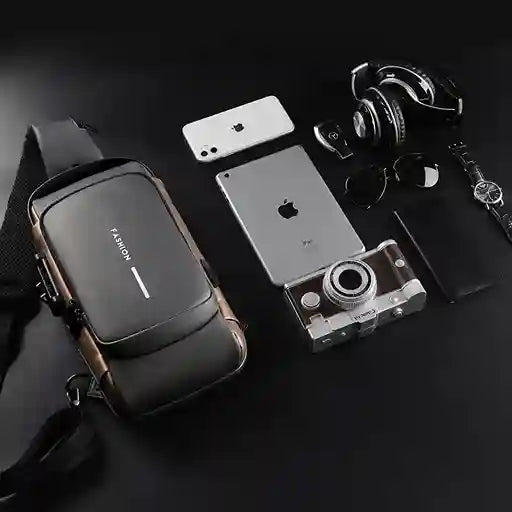 Collection of electronic devices including a camera, phone, and watch on a dark surface.