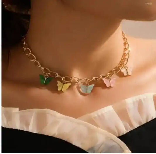 Necklace with colorful butterfly charms worn by a person