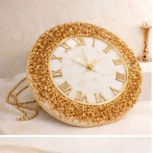 Decorative clock with gold embellishments on a white background
