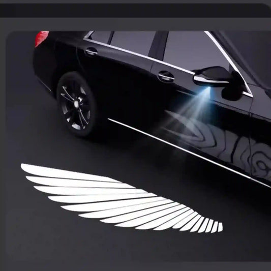 Car with a winged emblem projected onto the ground