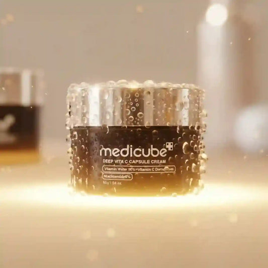 Jar of Medicube Deep Vita C Capsule Cream on a blurred background