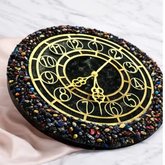 Decorative clock with colorful stone border on a white background