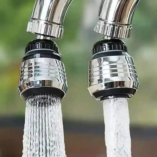 Two faucet nozzles with water flowing outdoors.