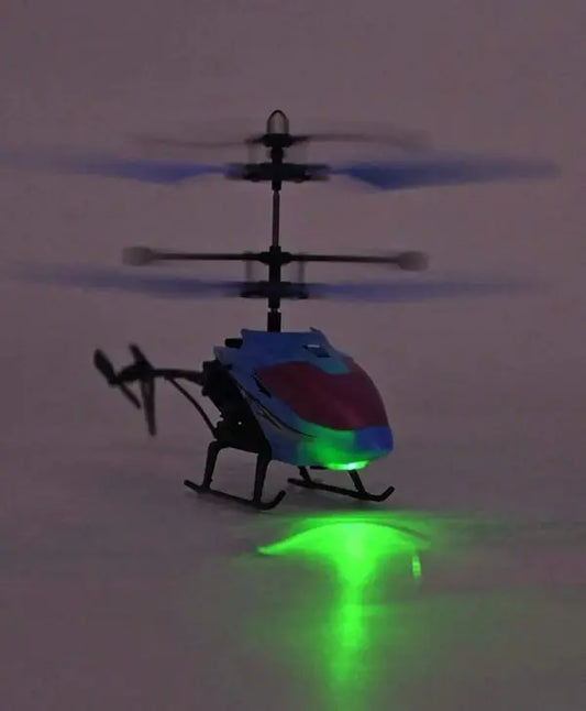 Glowing toy helicopter on a dark background