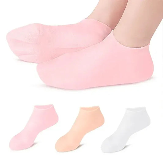 Set of three pairs of pink, peach, and white socks on a white background