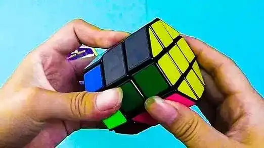 Person solving a Rubik's Cube with a blue background