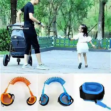 Person pushing a stroller with a child holding a blue leash, with additional leashes shown below.