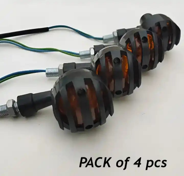 Pack of four motorcycle turn signals on a white background