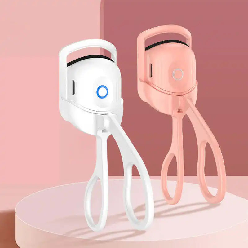 White and pink nail clippers on a pink background