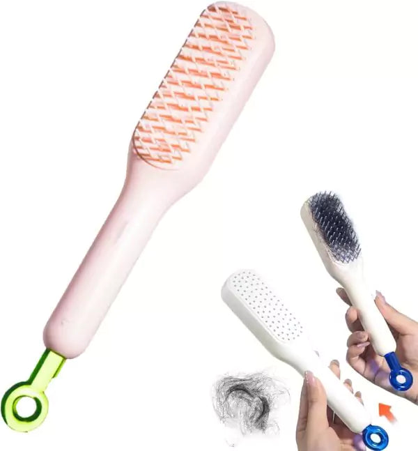 Two hairbrushes with different bristle designs and a hand holding one of them, with hair collected on the brush.
