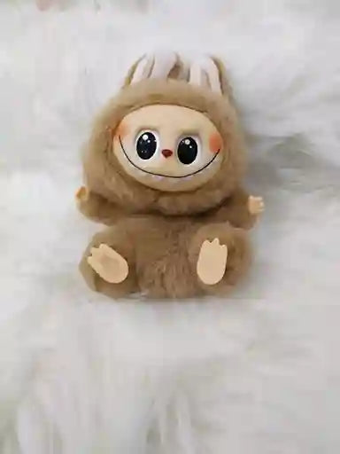 Plush toy sloth on a white background