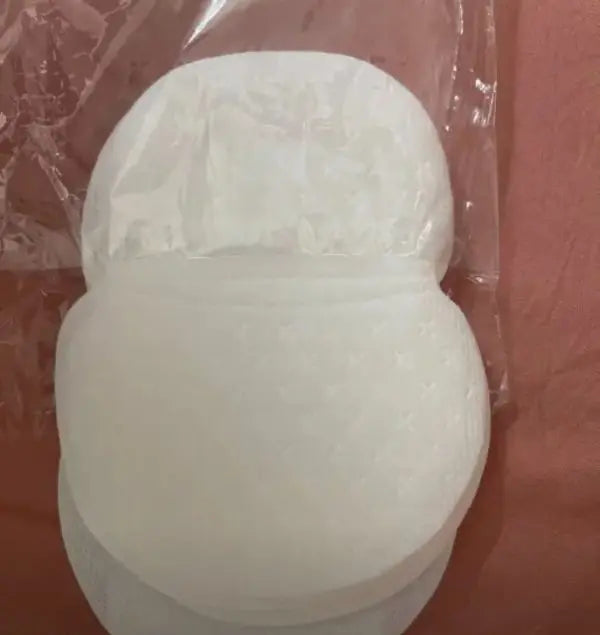 White silicone mold shaped like a snowman on a clear plastic background