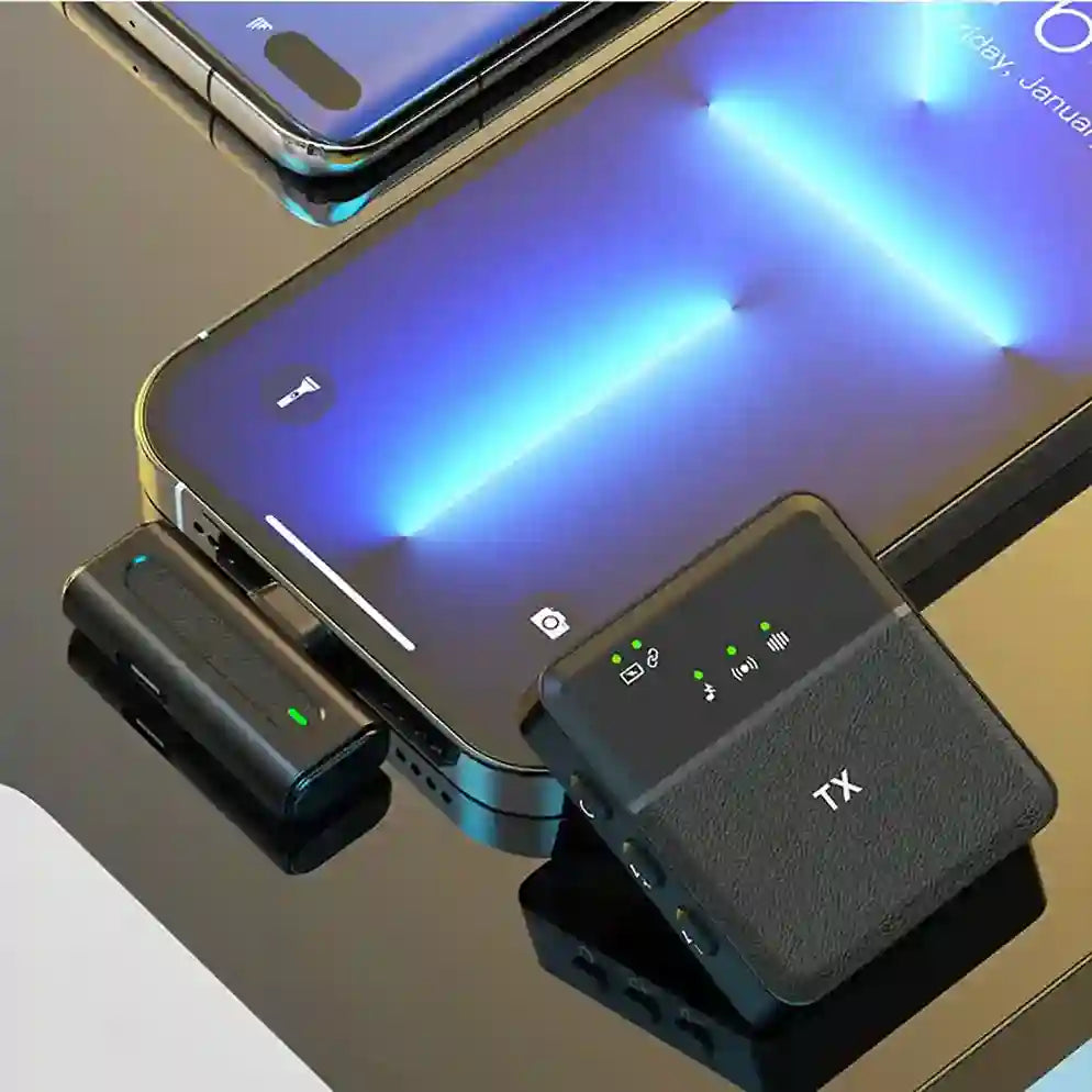 Two electronic devices with 'TX' and 'RX' labels on a reflective surface.