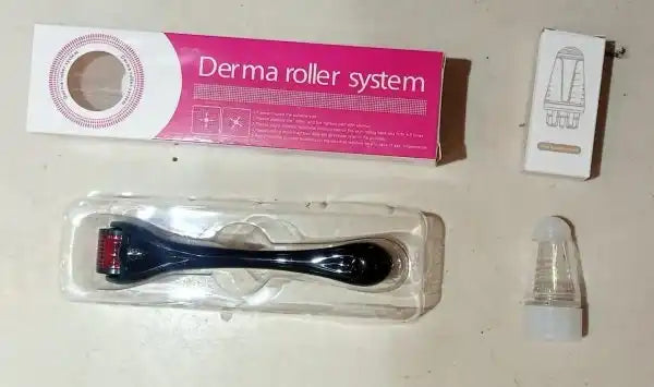 Derma roller system with packaging and accessories on a light surface