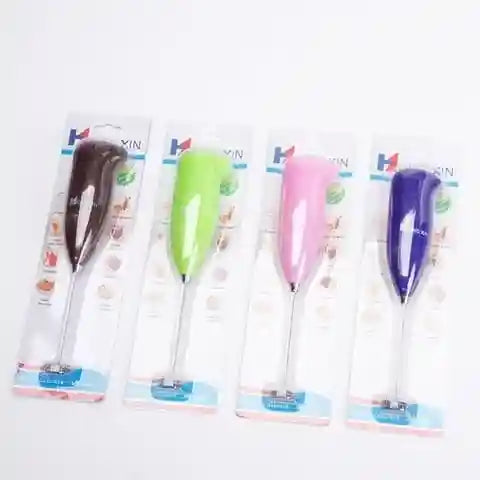 Four colorful handheld mixers in packaging on a white background