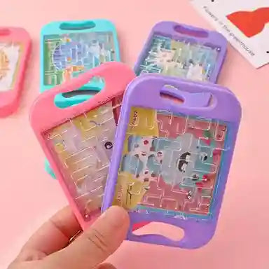 Colorful phone cases with puzzle designs held by a hand on a pink background