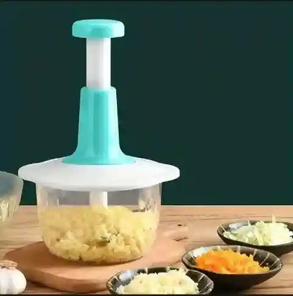 Vegetable chopper with chopped vegetables on a wooden table