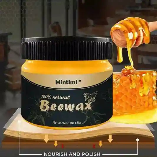 Jar of Mintiml beewax with honey being poured over it