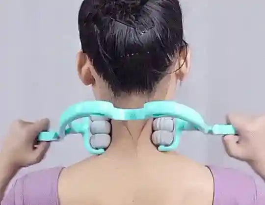 Person using a neck and shoulder massager on a plain background