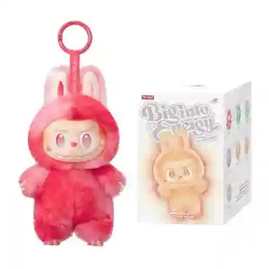 Plush toy with pink hair and a box of the same plush toy on a white background