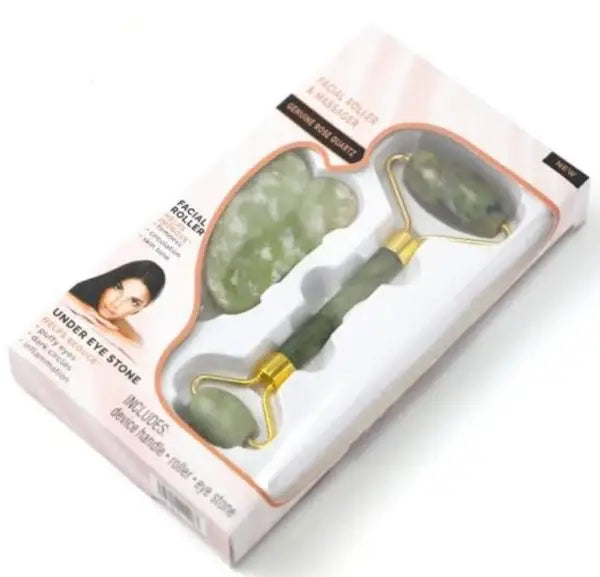Facial roller and jade stone set in packaging on a white background