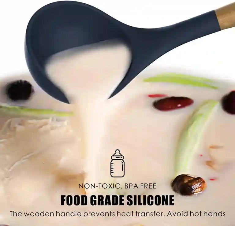 Black silicone spoon being used to serve a creamy dish with visible text about food grade silicone and safety features.