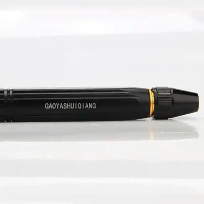 Black pen with gold accent on a white background