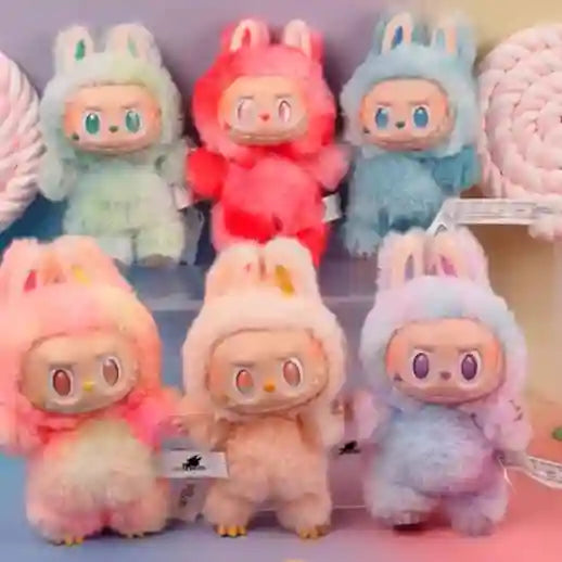 Colorful plush toys with bunny ears on a shelf