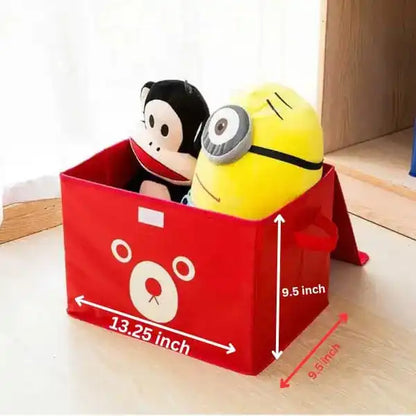 Red storage bin with cartoon design containing plush toys on a wooden surface