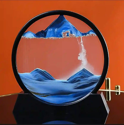 Glass sculpture of a mountain landscape with a black circular frame on an orange background