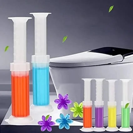Colorful syringes with floral decorations in front of a toilet.