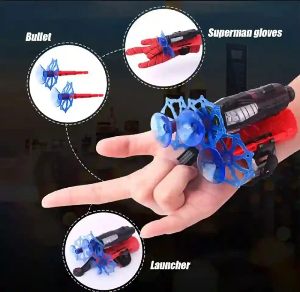 Hand holding a toy glove with attachments labeled 'Bullet', 'Superman gloves', and 'Launcher' on a dark background.