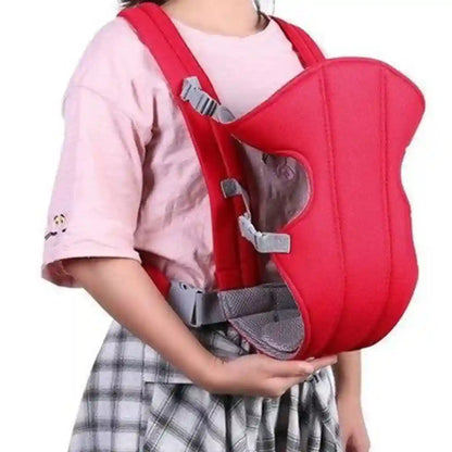 Red baby carrier worn by a person on a white background
