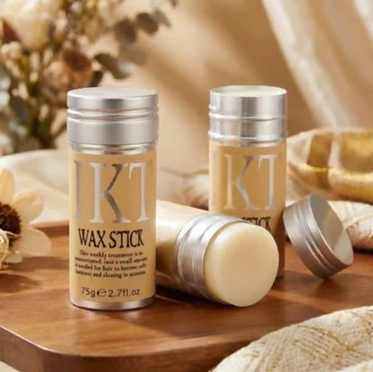 KT Wax Stick packaging on a wooden surface with a neutral background