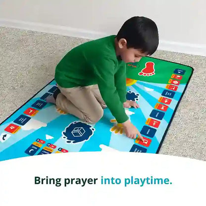 Child playing on a colorful prayer mat with text 'Bring prayer into playtime.'