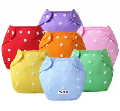 Set of colorful cloth diapers with white polka dots on a white background