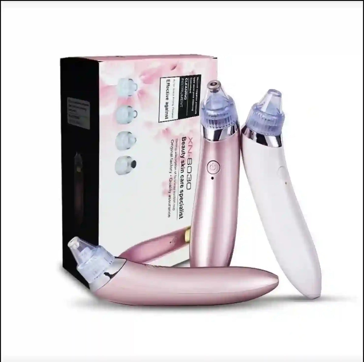 Pink and white skincare device with packaging on a white background