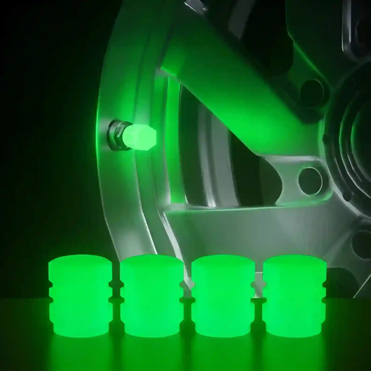 Green wheel locks on a car wheel with a dark background