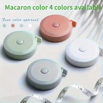 Retractable tape measure in various pastel colors on a light background