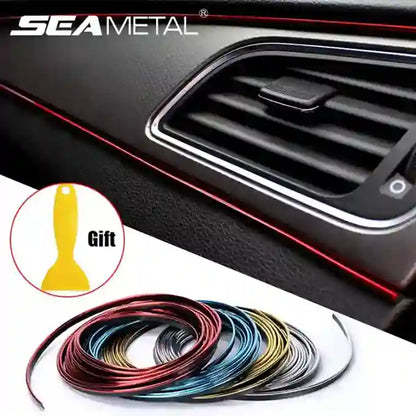 Car interior with air vent, colorful car trim strip, and small yellow tool on a white background.