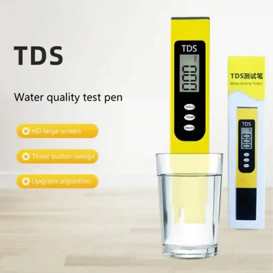 TDS water quality test pen with digital display next to a glass of water on a light background