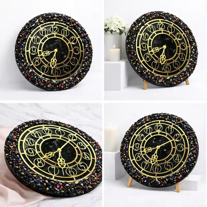 Decorative wall clock with black and gold design on a white background