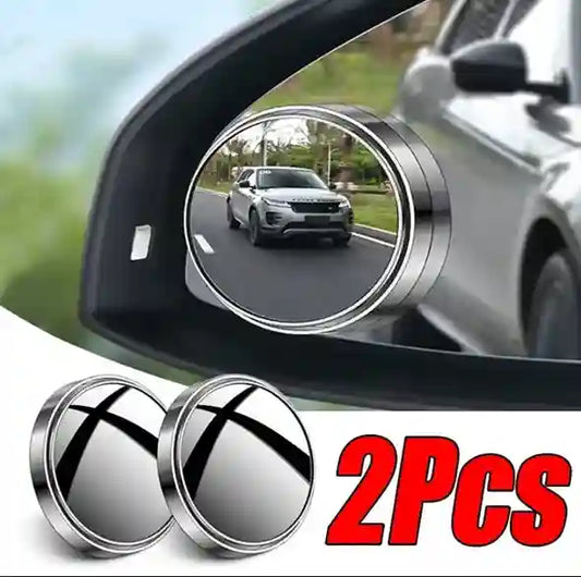 Car side mirror with a round convex mirror attachment and two additional mirrors below.