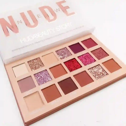 Makeup palette with various shades of lipsticks and shadows, labeled 'Nude'.