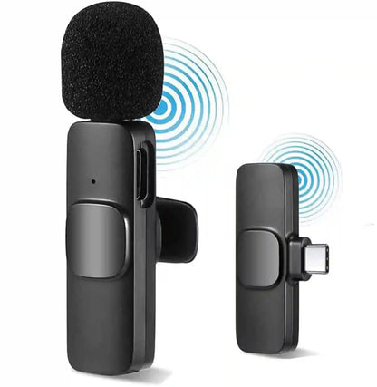 Black wireless microphone transmitter and receiver on a white background