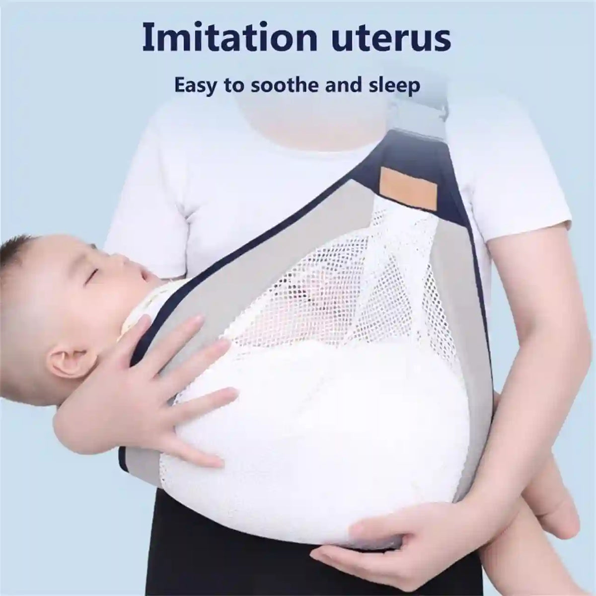 Person wearing a baby carrier with a child inside, labeled 'Imitation uterus'.