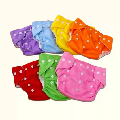 Set of colorful baby diapers with white polka dots on a white background