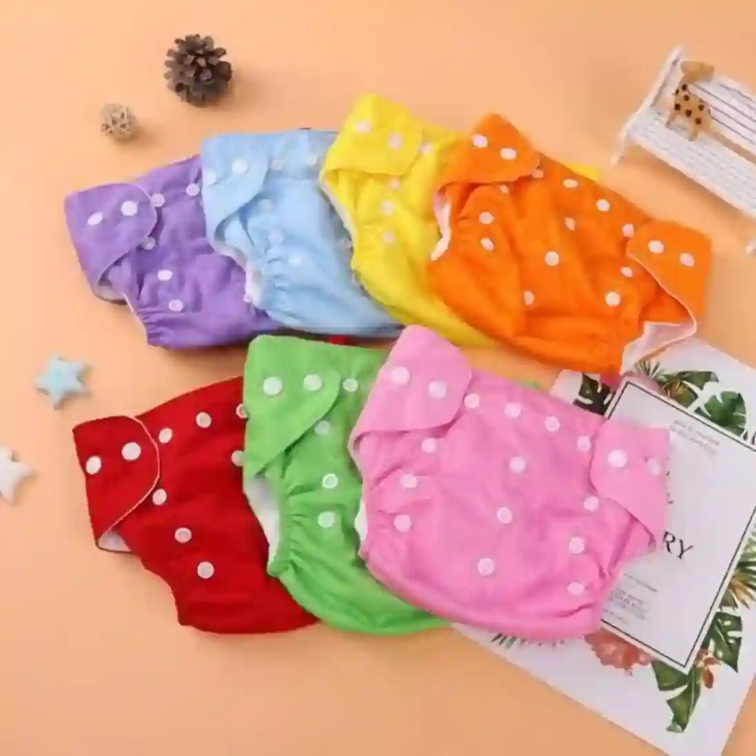 Colorful baby diapers with polka dots on a magazine page